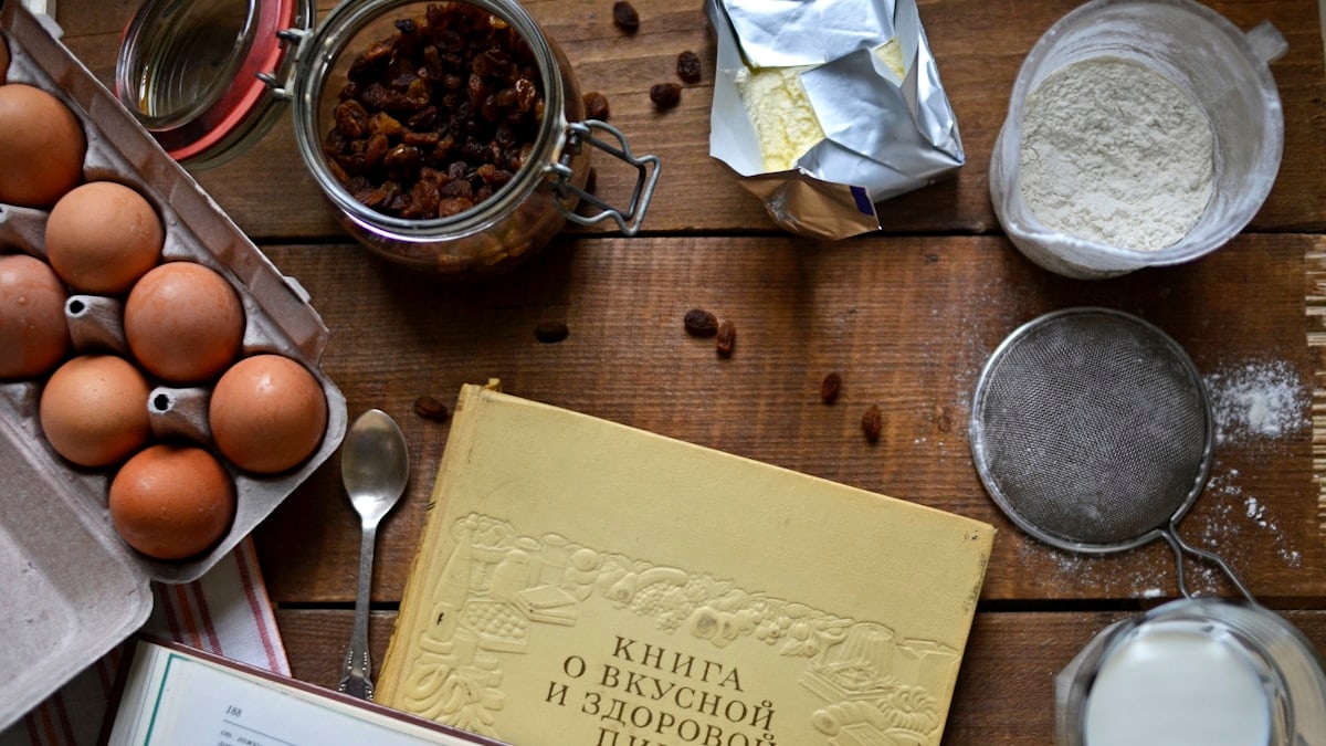 an open book sitting on top of a wooden table